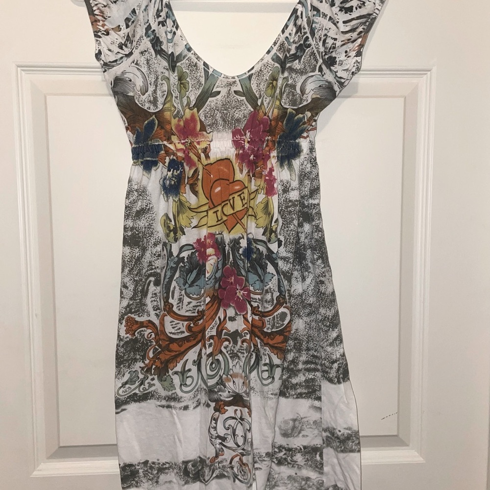 "T-Shirt" soft dress. The detailed art and swoop neck are both on front & back